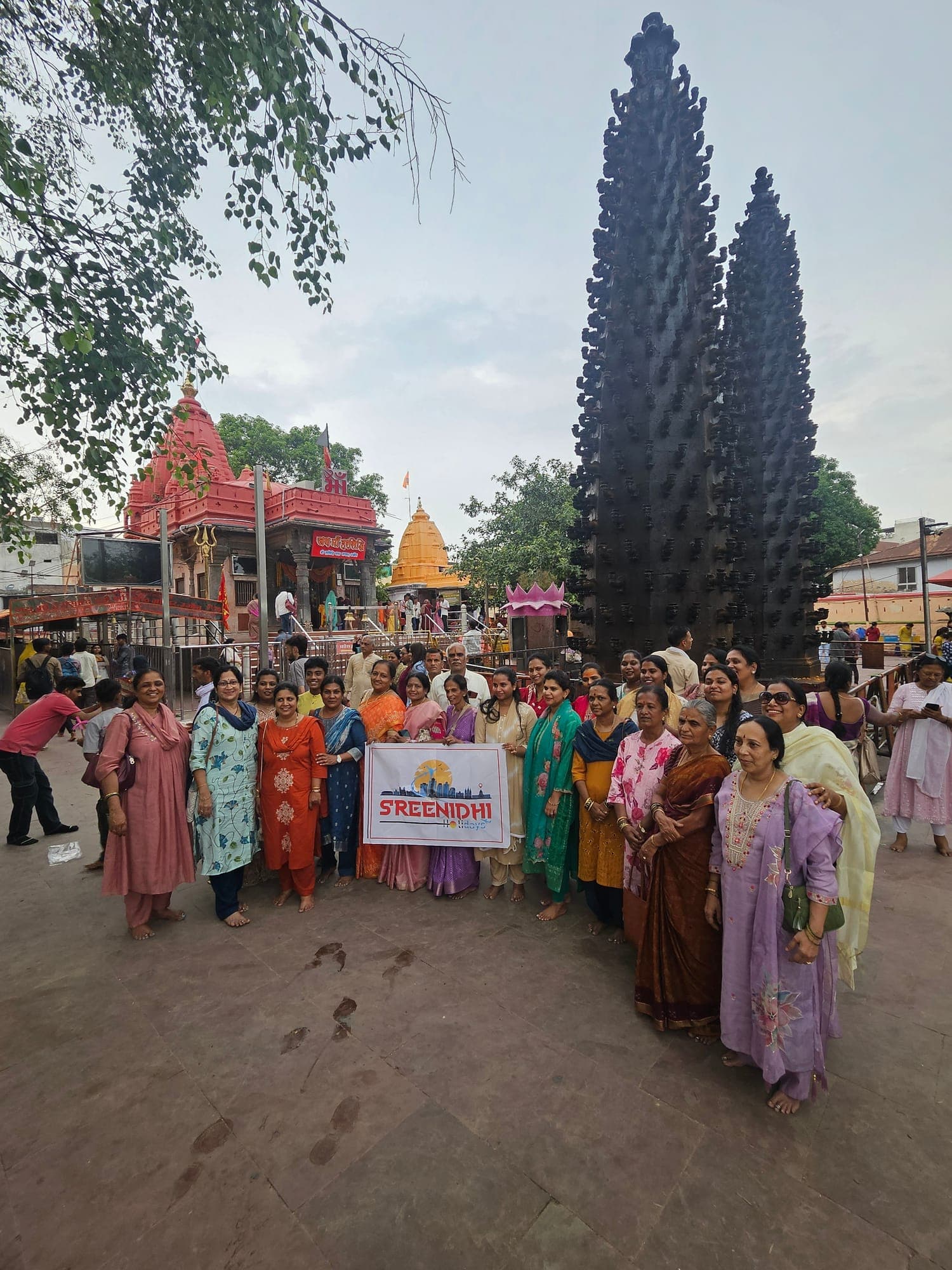 Sreenidhi Holidays pilgrims outside a temple