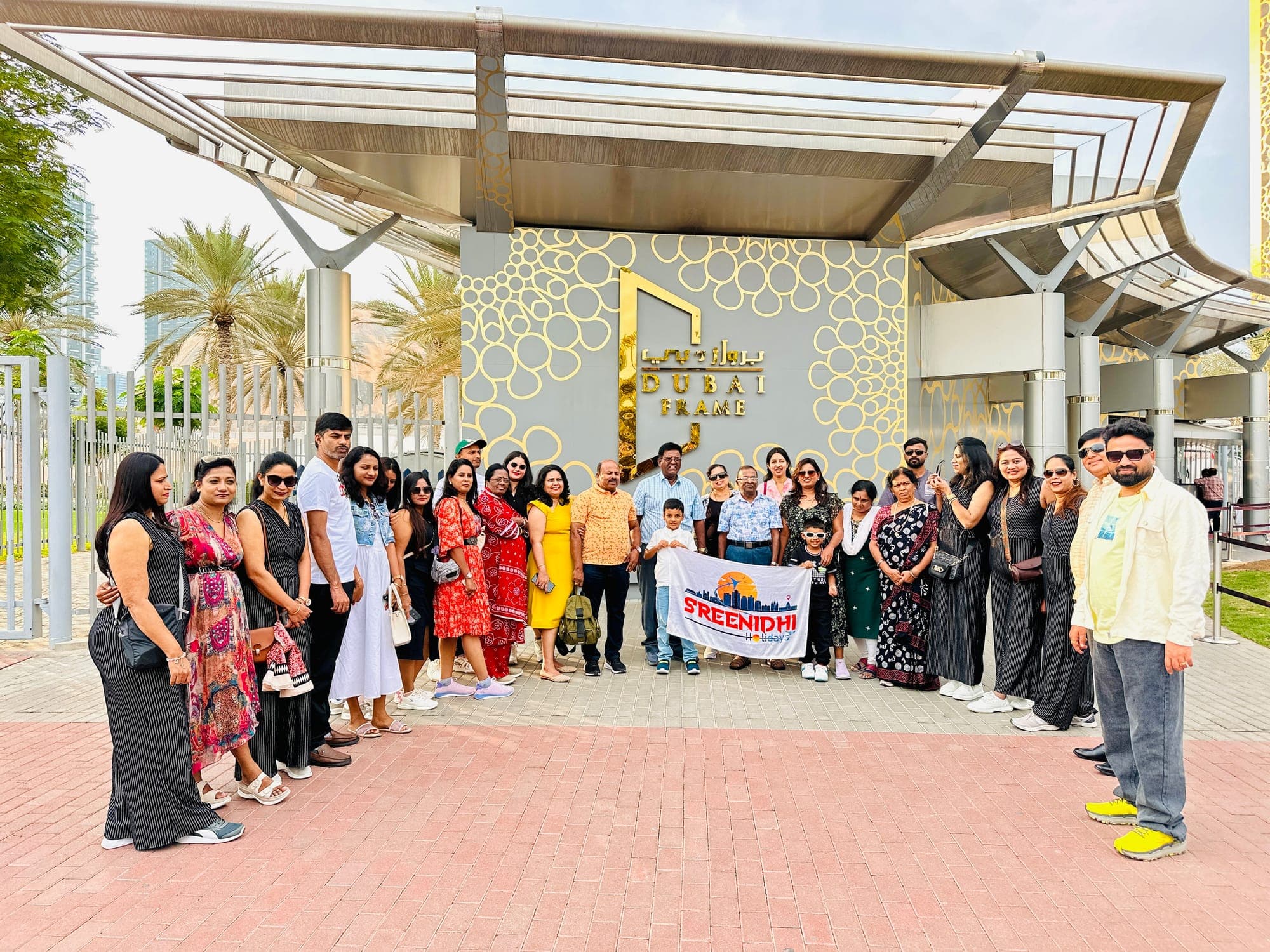 Sreenidhi Holidays group outside the Dubai Frame