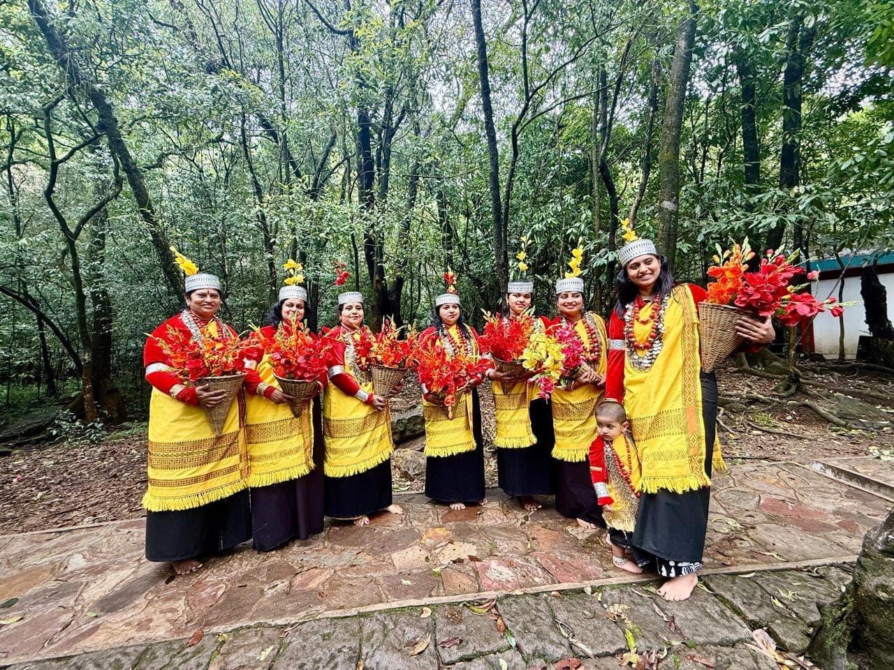 Folk dancers in traditional red and yellow costumes
