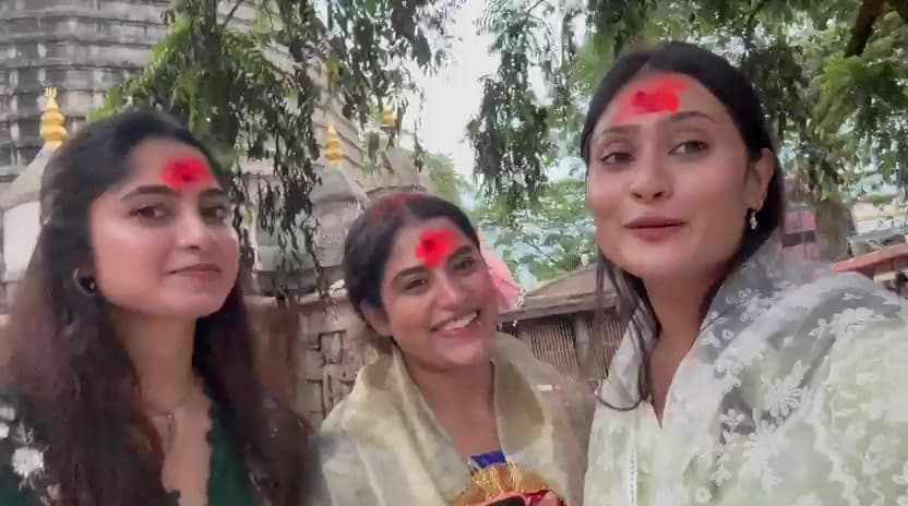 Pilgrims with vermilion tilak after darshan