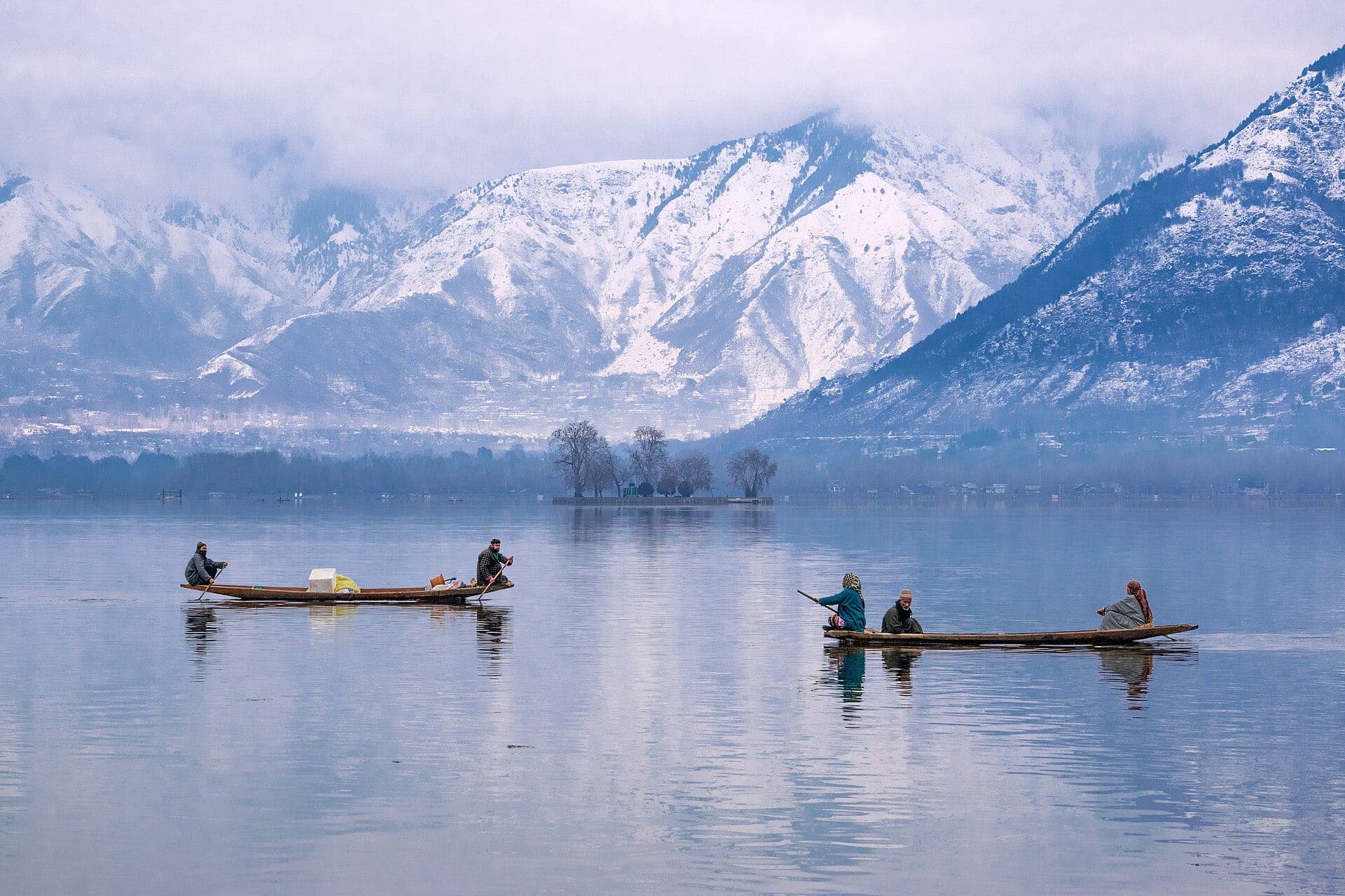 Shikaras on Dal Lake below snowy peaks, Srinagar