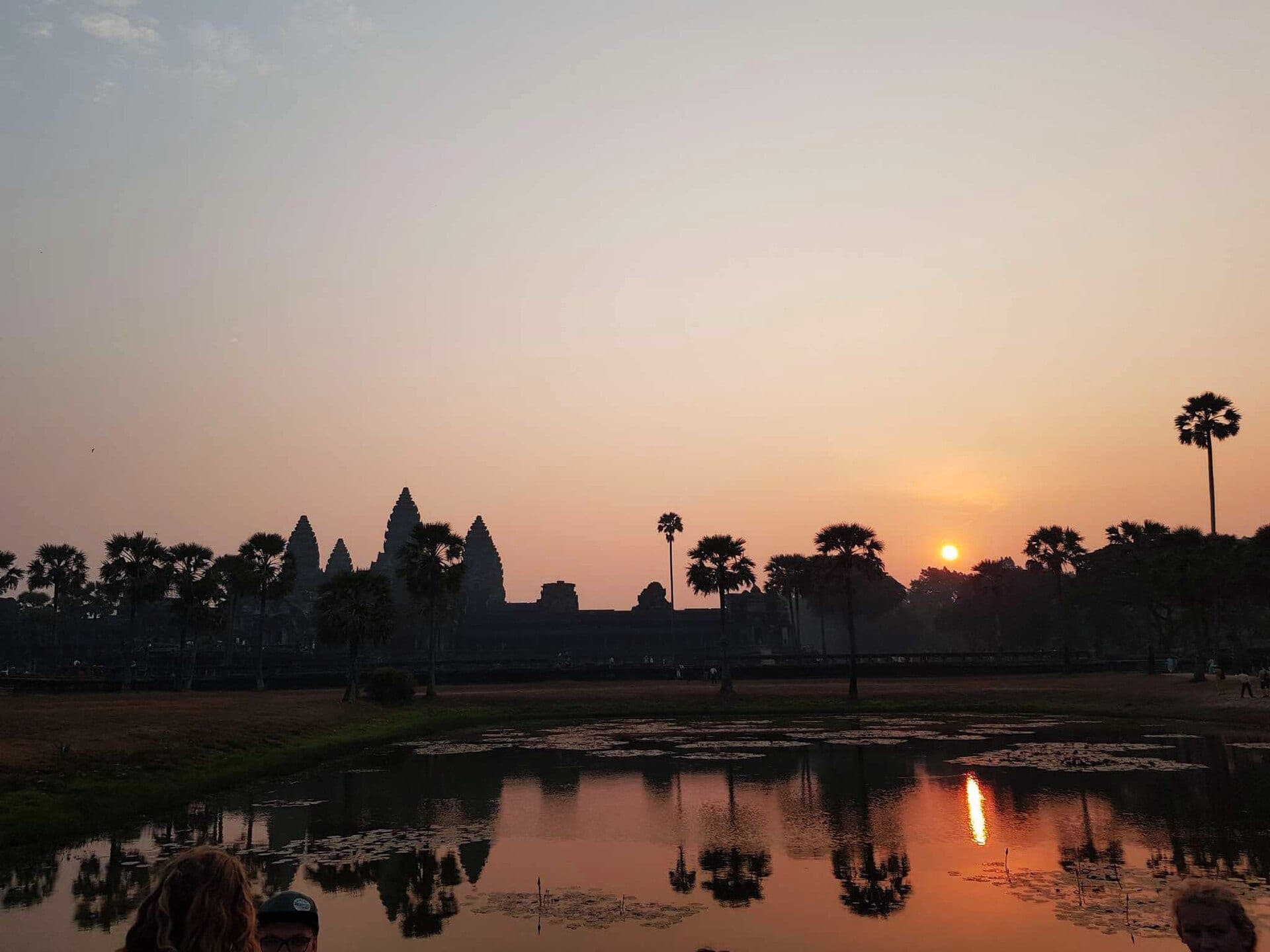 Angkor Wat reflected in the lotus pond at sunrise